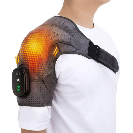 Person wearing a shoulder heating pad with digital display on a white background